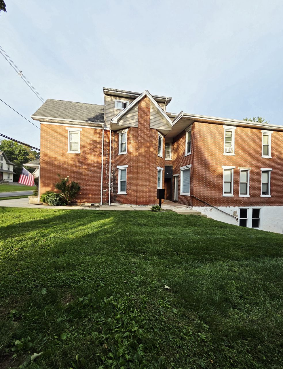 Brick apartment building with white-trimmed windows